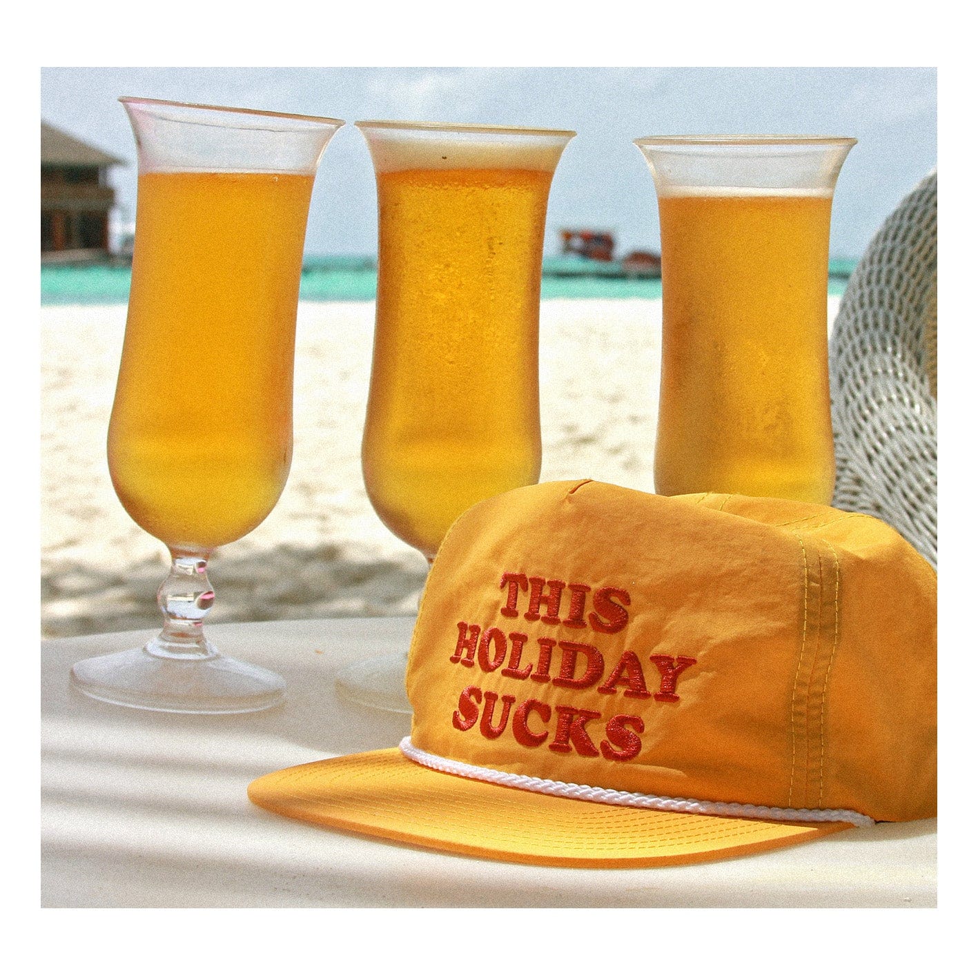 This Holiday Sucks Yellow Cap by Lobster Shanty